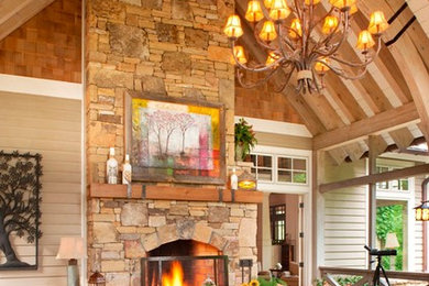 Inspiration for a large rustic backyard patio remodel in Other with a fire pit, decking and a roof extension