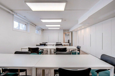 Inspiration for a large modern vinyl floor and gray floor basement remodel in Toronto