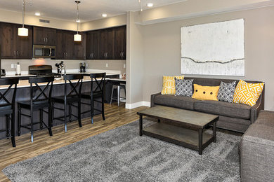 Inspiration for a small mediterranean l-shaped vinyl floor and beige floor open concept kitchen remodel in Salt Lake City with an undermount sink, flat-panel cabinets, dark wood cabinets, quartz countertops, white backsplash, stainless steel appliances and an island
