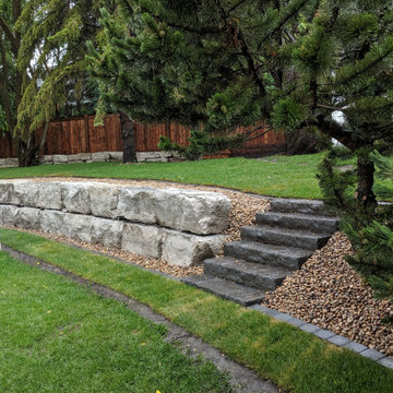 Finished Natural Boulder retaining wall in Edmonton