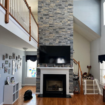 Northern Slate Stacked Stone Two Story Fireplace Surround