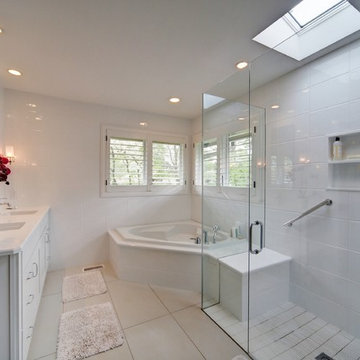 Clean contemporary white on white master bath