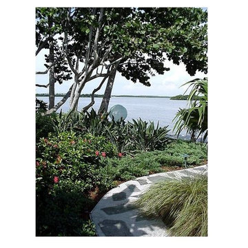 Quiet stone paths journey through lush plantings to discover art..