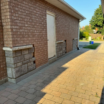 Transition of Brick To Stone Masonry Skirt With Limestone Sill