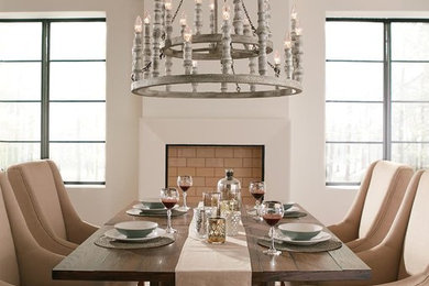 Example of a transitional light wood floor and beige floor enclosed dining room design in Other with white walls