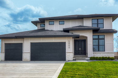 Example of a mid-sized transitional gray two-story mixed siding exterior home design in Other