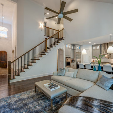 Open Layout. Foyer chandeliers. Stair wall art pending.