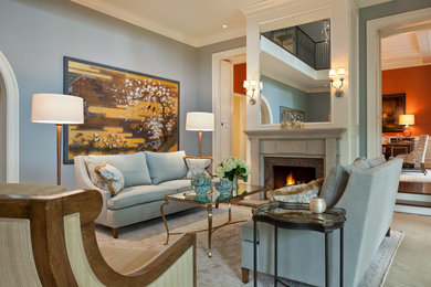 Inspiration for a traditional formal enclosed living room in Columbus with blue walls, carpet and a standard fireplace.