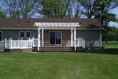 Large elegant backyard deck photo in Indianapolis with a pergola