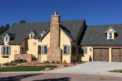 This is an example of an arts and crafts one-storey beige exterior in Denver.