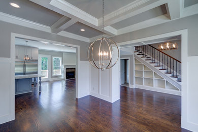 Kitchen/dining room combo - large transitional medium tone wood floor and brown floor kitchen/dining room combo idea in Atlanta with multicolored walls and no fireplace