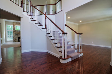 Example of a classic dark wood floor foyer design in Philadelphia