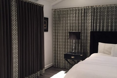 Inspiration for a modern master dark wood floor bedroom remodel in DC Metro with white walls