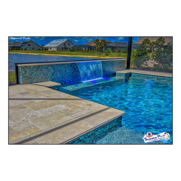 (Rennehan) FT MYERS FL Superior Pools Swimming Pool With Raised Wall & Waterfall