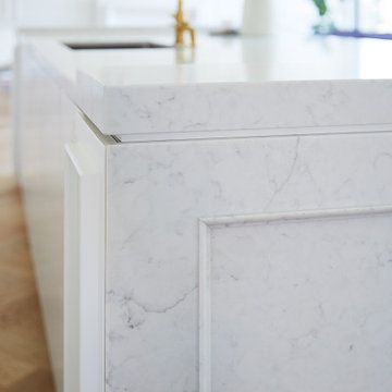 Sleek, White, Quartz-Embellished Kitchen