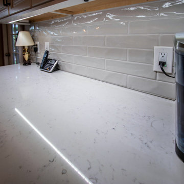 White Shaker Kitchen with Carrara Grigio Quartz Countertops and Subway Tile