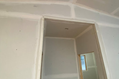 Inspiration for a hallway remodel in Other with white walls