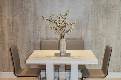Inspiration for a mid-sized modern ceramic tile and beige floor great room remodel in Miami with beige walls and no fireplace