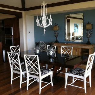 Photo of a mid-sized tropical open plan dining in DC Metro with blue walls and medium hardwood floors.