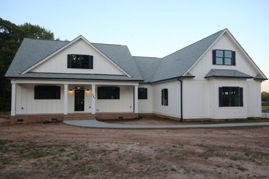 Example of a cottage exterior home design in Other