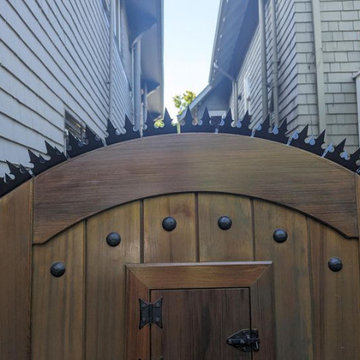 GizaGiza Heart Dual Bladed Black Finish on the Wooden Gate