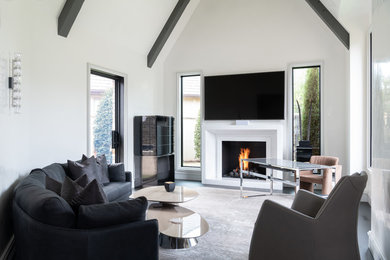 Living room - large modern open concept ceramic tile and gray floor living room idea in Oklahoma City with white walls, a standard fireplace, a plaster fireplace and a wall-mounted tv