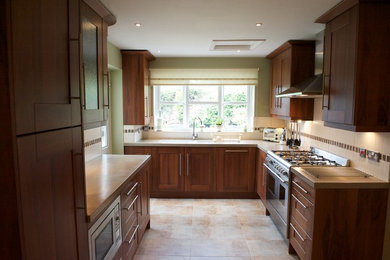 Photo of a transitional kitchen in Cambridgeshire.
