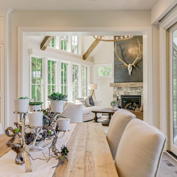 Reclaimed Wood Table, Beams, and Mantel in Modern White Dining Room