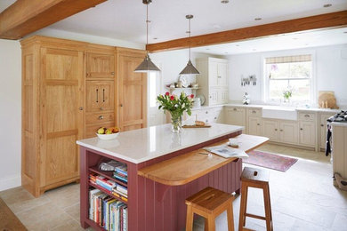 Inspiration for a large traditional u-shaped open plan kitchen in Other with with island, a farmhouse sink, shaker cabinets, quartzite benchtops and ceramic floors.