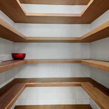 Walk-In Pantry Lined in Solid Walnut Shelving