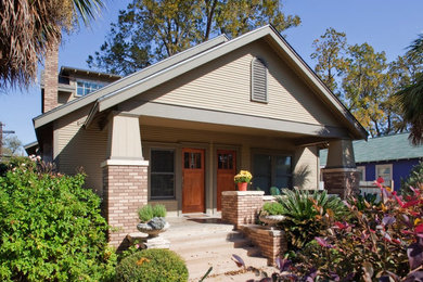 Mid-sized arts and crafts gray two-story wood exterior home photo in Austin with a shingle roof