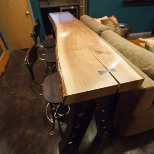 Home theater - small contemporary enclosed concrete floor and brown floor home theater idea in Seattle with blue walls and a wall-mounted tv