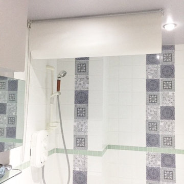 Senspasce shower blind in white rolled up