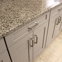 Grey Kitchen With White Subway Tile Backsplash And Granite