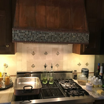 Copper Hood with Mosaic Tile banking and Copper Rope trim
