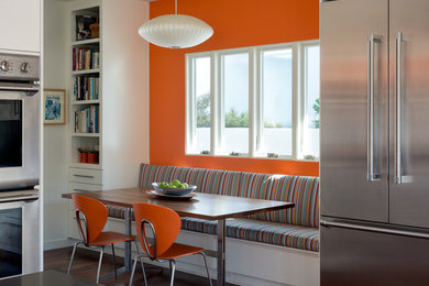 Inspiration for a large contemporary eat-in kitchen remodel in Los Angeles with white cabinets, stainless steel appliances and an island