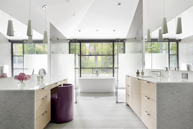 Bathroom - contemporary master gray floor bathroom idea in New York with flat-panel cabinets, light wood cabinets and white walls