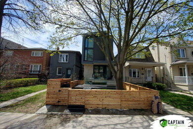 Example of a large trendy home design design in Toronto