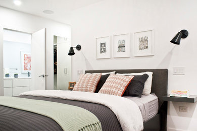 Example of a mid-sized trendy master dark wood floor and brown floor bedroom design in Other with white walls