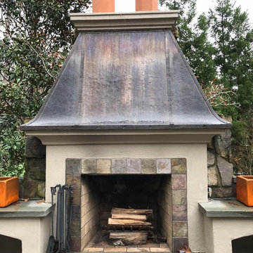 French Quarter style Fireplace with Copper overlay and firewood storage