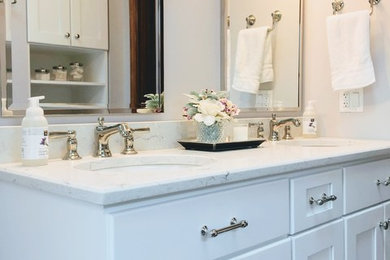Mid-sized transitional 3/4 beige tile and ceramic tile alcove shower photo in Chicago with beaded inset cabinets, white cabinets, a one-piece toilet, beige walls, a drop-in sink, quartzite countertops and white countertops