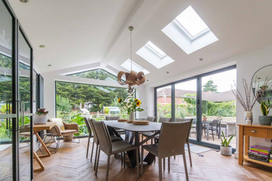 Design ideas for a contemporary dining room in West Midlands.