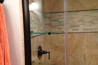 Bathroom - large transitional master multicolored tile and porcelain tile porcelain tile bathroom idea in Baltimore with an integrated sink, raised-panel cabinets, white cabinets, solid surface countertops, a two-piece toilet and blue walls