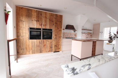 Photo of a transitional kitchen in London.