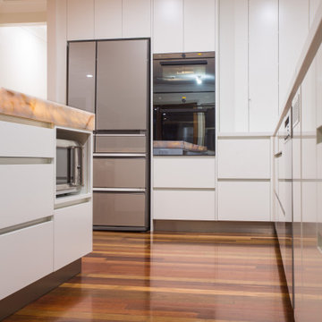 Contemporary kitchen with a stunning illuminated island bench