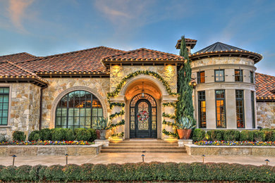 Inspiration for a mediterranean exterior home remodel in Dallas