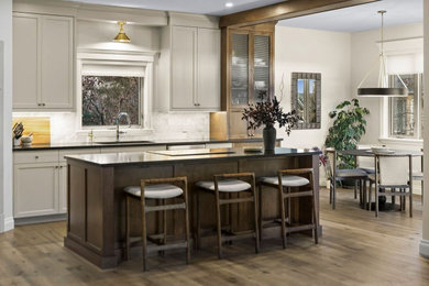 Example of a transitional kitchen design in Calgary