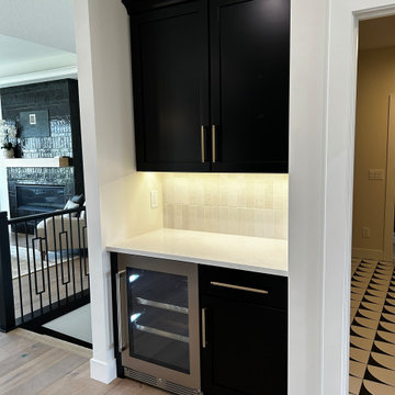 Black and Maple Wheat Kitchen with Brass Banded Hood