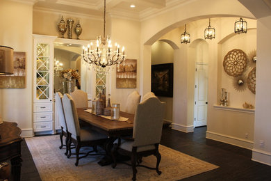 Design ideas for a large traditional separate dining room in Dallas with beige walls, dark hardwood floors, no fireplace and brown floor.