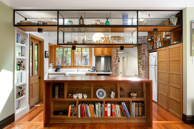 Design ideas for an eclectic l-shaped kitchen in Melbourne with a farmhouse sink and with island.